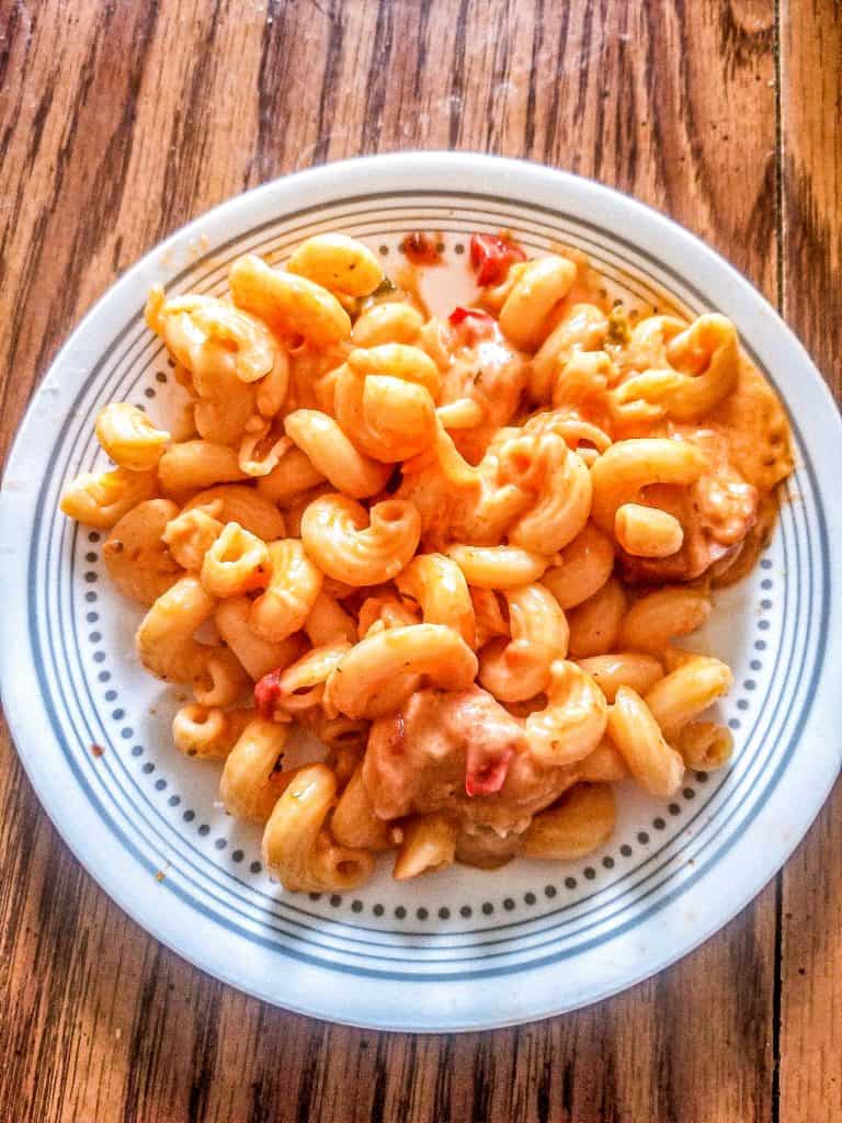 cajun sausage tomato pasta on a plate.