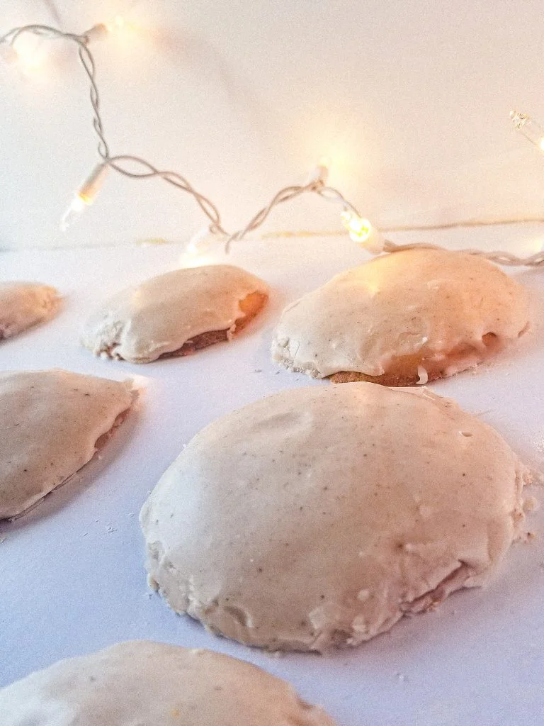 eggnog cookies side angle with lights in background.