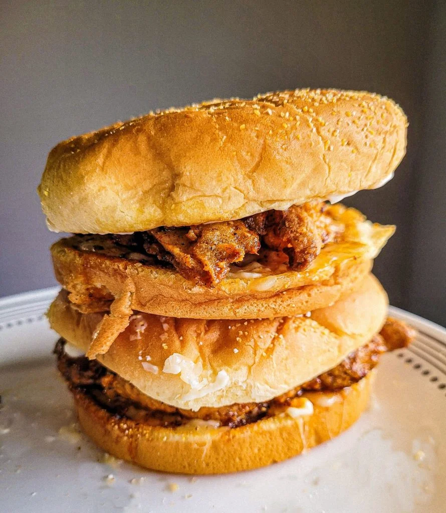 chicken patty in air fryer on a white plate. 